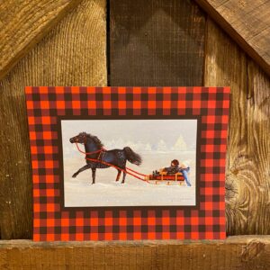 8x10 print- red and black border check pattern- print of a mini horse pulling 2 children in a sleigh on a snowy day.